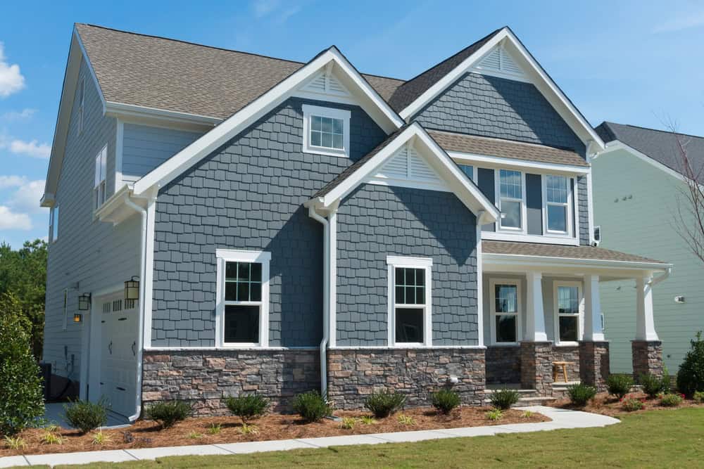 Blue exterior shakes home side load garage