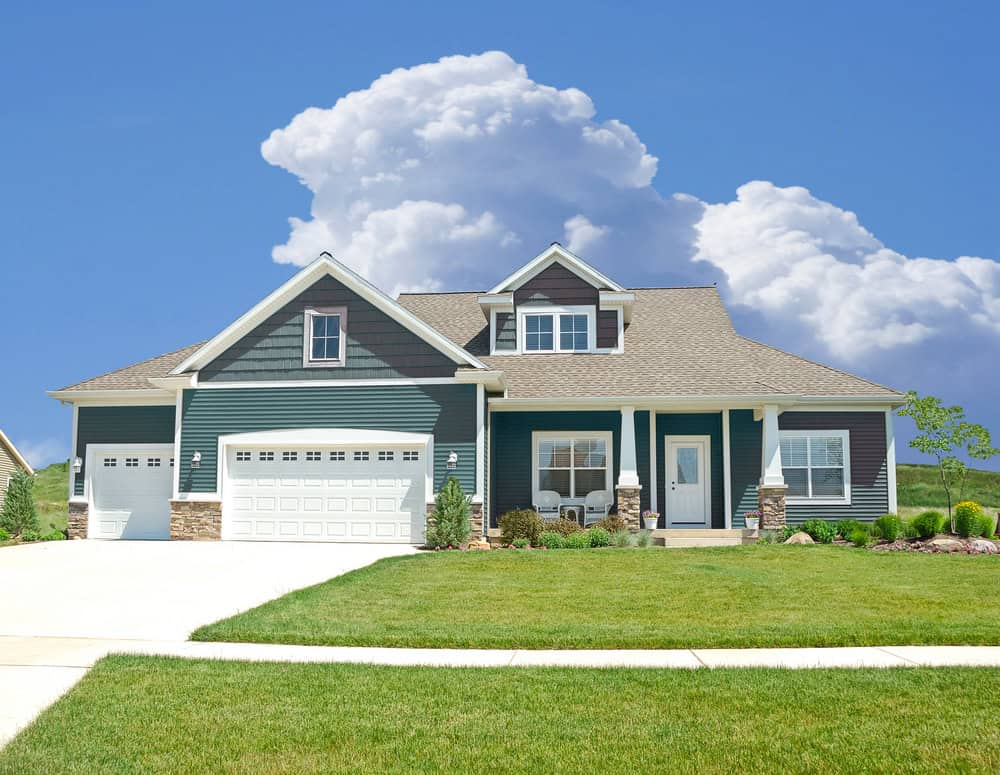 Vinyl siding exterior with stone veneer accents