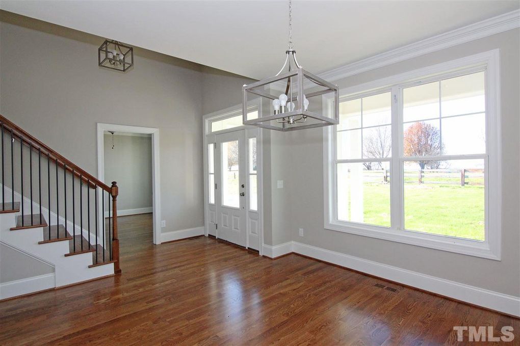 Formal dining room in new farmhouse on acreage by Chatham County custom home builder Travars Built Homes