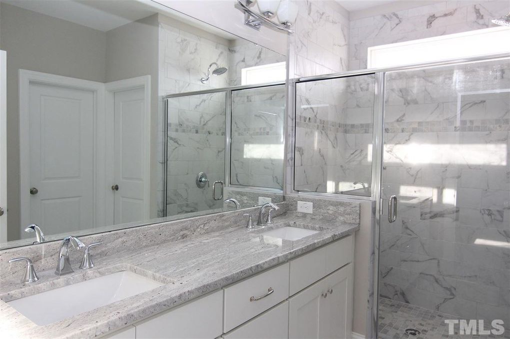Master Bath with marble tile and granite countertops.  Modern Farmhouse built in Chatham County