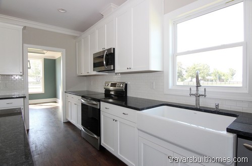 This modern farmhouse-style family home's kitchen features Emtek's cabinet  hardware - Trail P…