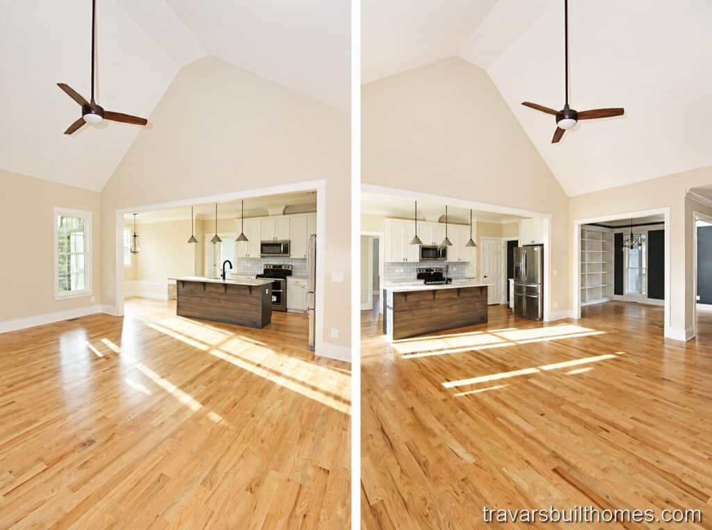 Bright and spacious open-concept living room and kitchen area featuring a high vaulted ceiling with a dark ceiling fan, rich natural oak hardwood floors, and a seamless flow into a gourmet kitchen.