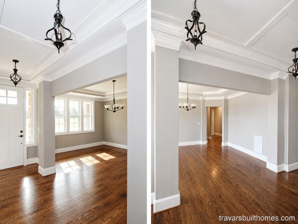 Split view of a grand open foyer featuring elegant tray ceiling details, light greige walls, dark iron cage pendant lights, and clear transitions into a formal dining space, designed by Travars Built Homes.
