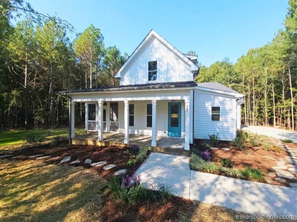 Siler City Custom Homes. The two car garage is a side-entry with wrap-around walkway to the front porch. Sliding glass doors lead from the living room to the screen porch. wake county home builder
