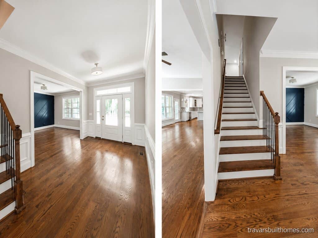Split perspective of a grand foyer featuring a bright entryway leading to a formal dining room with a navy accent wall on the left, and a beautiful wooden staircase with iron balusters on the right, crafted by Travars Built Homes.