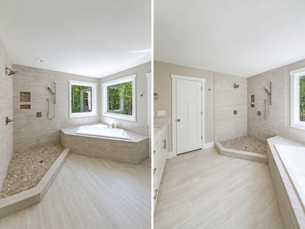 Split perspective of a custom primary bathroom showcasing a corner soaking tub next to an open walk-in shower with pebble tile flooring on the left, and a white entry door with adjacent vanity space on the right, by Travars Built Homes.