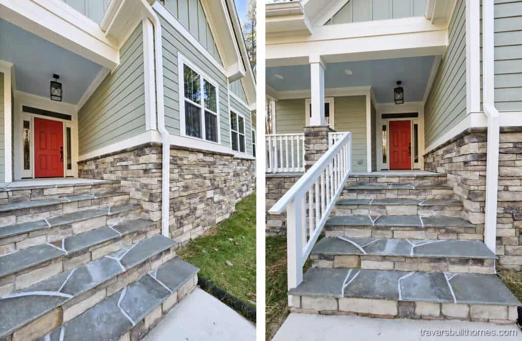 Inviting custom home front entry highlighting a stone staircase, white railings, a light blue porch ceiling, and a vibrant red front door, built by Travars Built Homes.