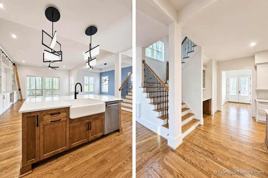 Custom open-concept layout showcasing a modern kitchen with a dark wood island and white farm sink, adjacent to a beautiful hardwood staircase with dark iron balusters, by Travars Built Homes.